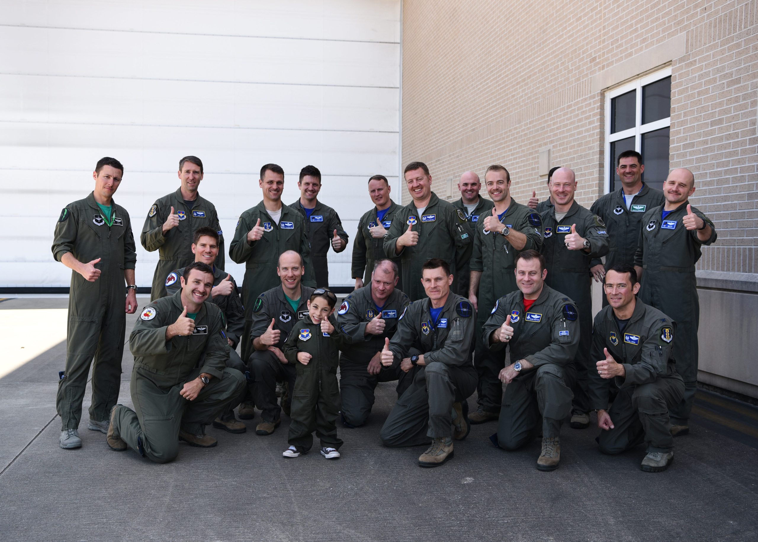 Ethan Ibi, pilot for a day, poses with the 58th Fighter Squadron "Gorillas" pilots March 9 at Eglin Air Force Base. The 33rd Fighter Wing hosted Ethan Ibi and his family for the "Pilot for a Day" program. [AIRMAN 1ST CLASS EMILY SMALLWOOD | U.S. AIR FORCE]