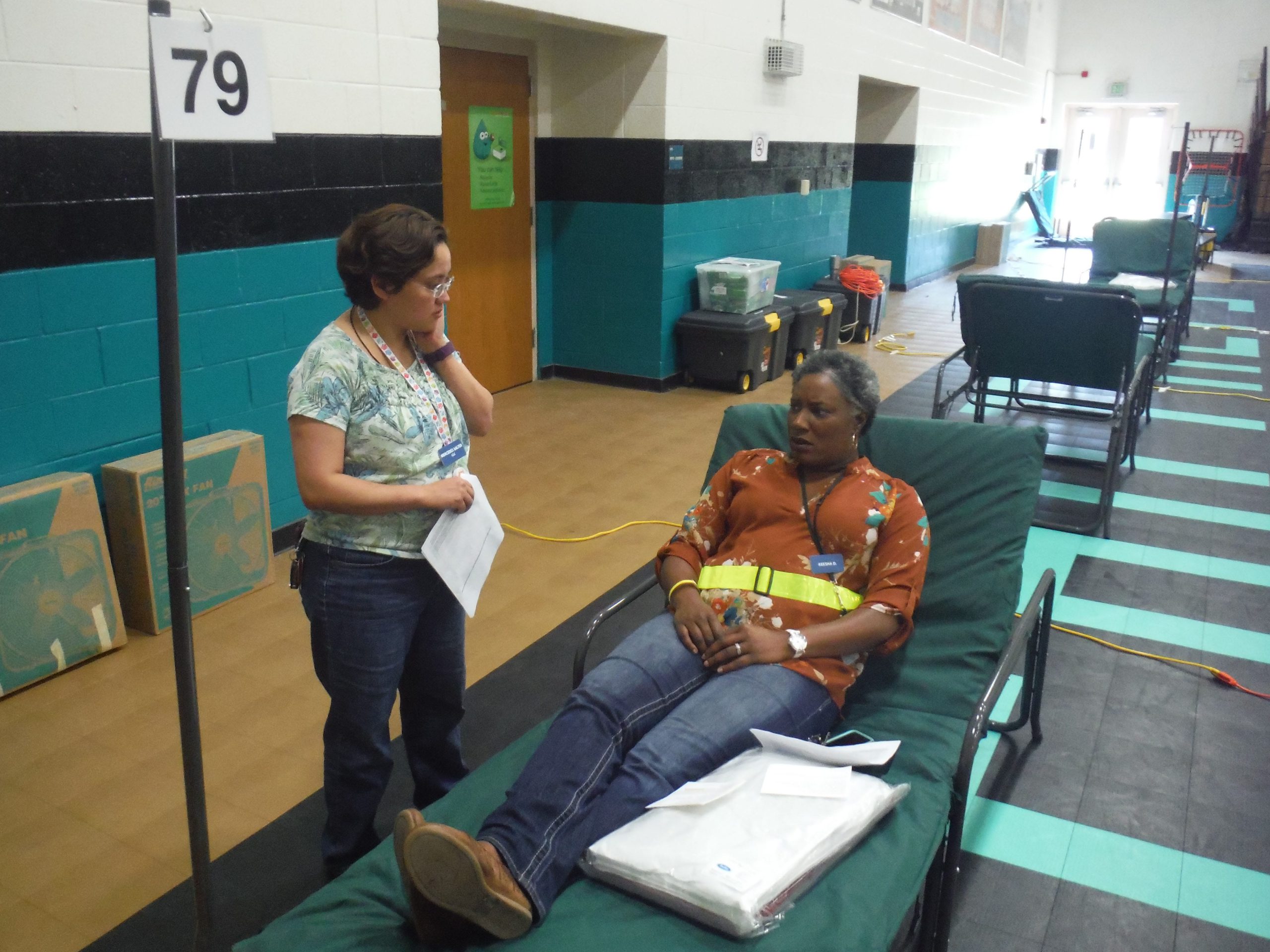 Okaloosa County Health Department employees Mercedes Salter (left) and Lakeesha Clarke role-play a special needs shelter scenario. Salter plays the part of a caregiver, while Clarke plays an evacuee who is an insulin-dependent diabetic. [AARON JACOBS|NEWS BULLETIN]