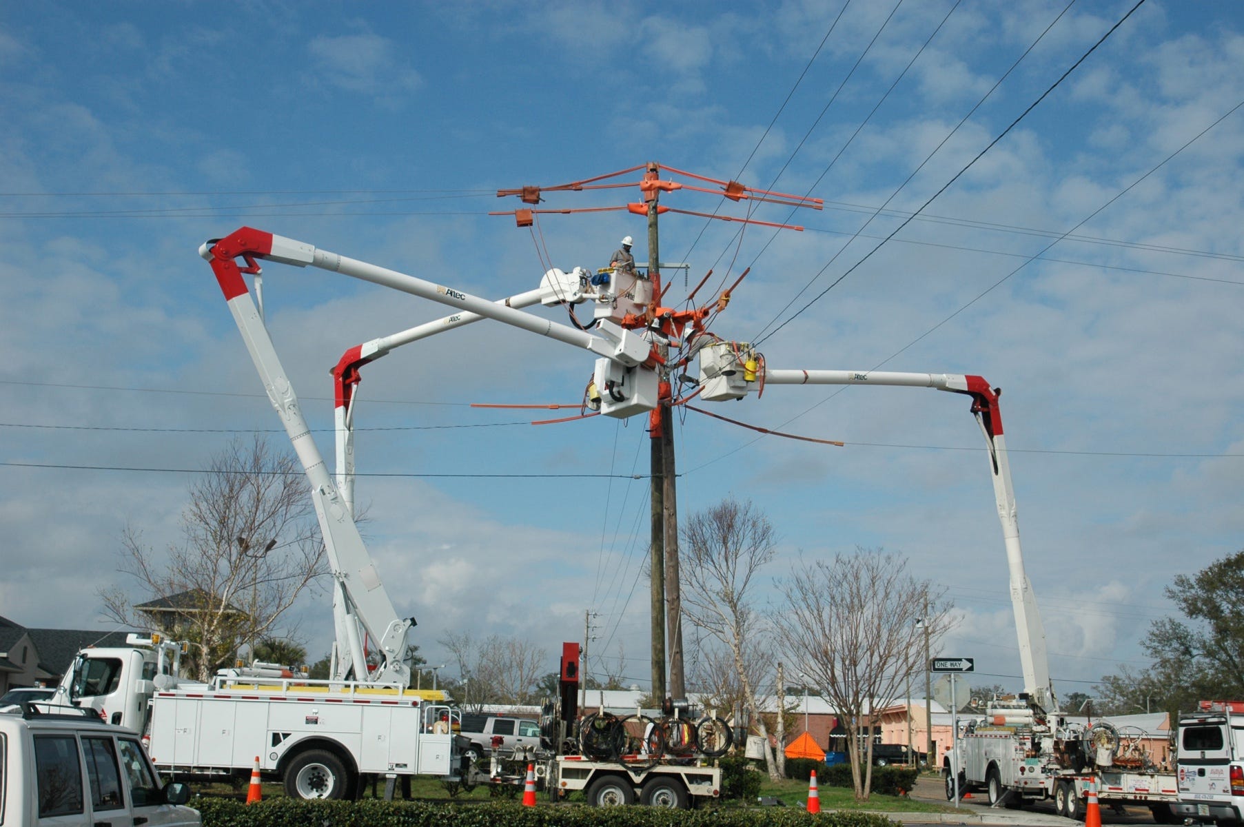 Gulf Power crews replace an old pole with a new one in Pensacola. [Special to the Press Gazette]