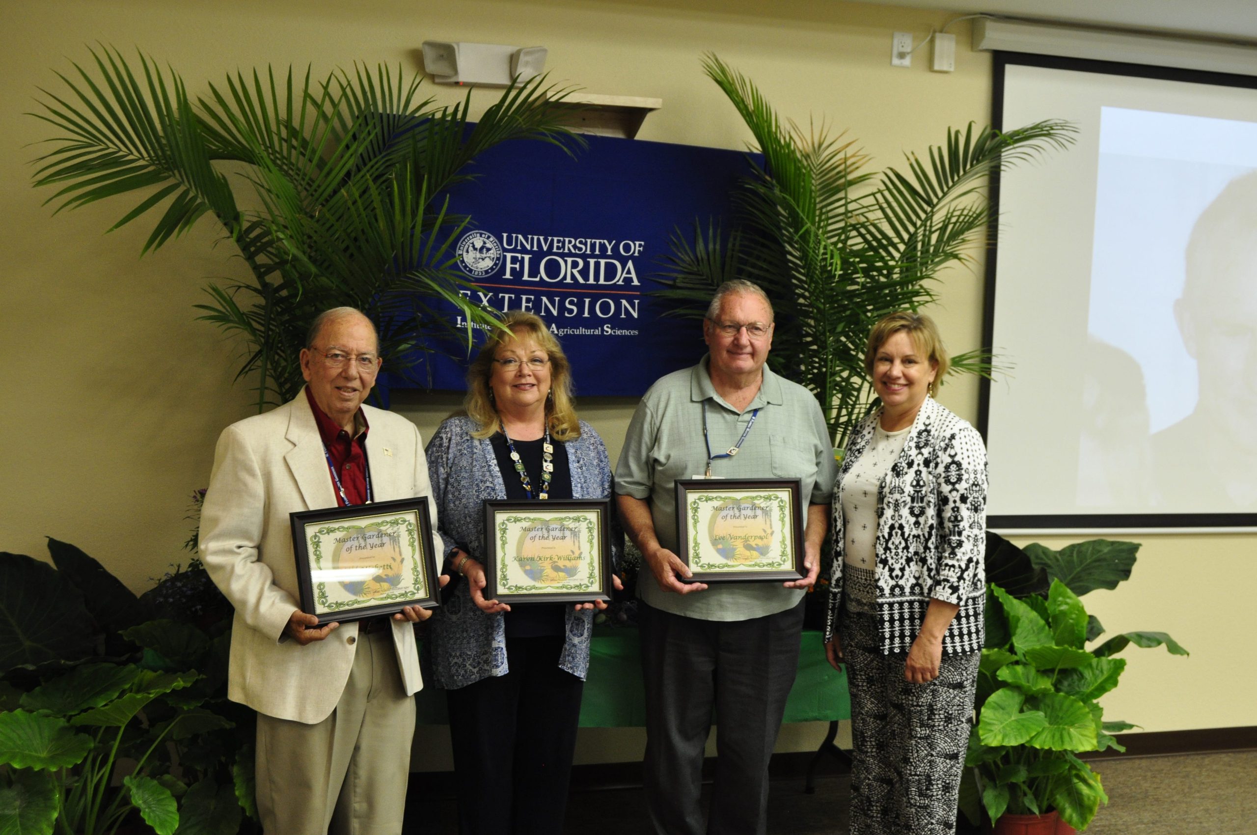 Okaloosa County Extension Director Pam Allen (right) presents the 2017 Master Gardener of the Year awards: (from left) Joe Michetti, Karen Kirk-Williams, Lee Vanderpool. [AARON JACOBS|NEWS BULLETIN]