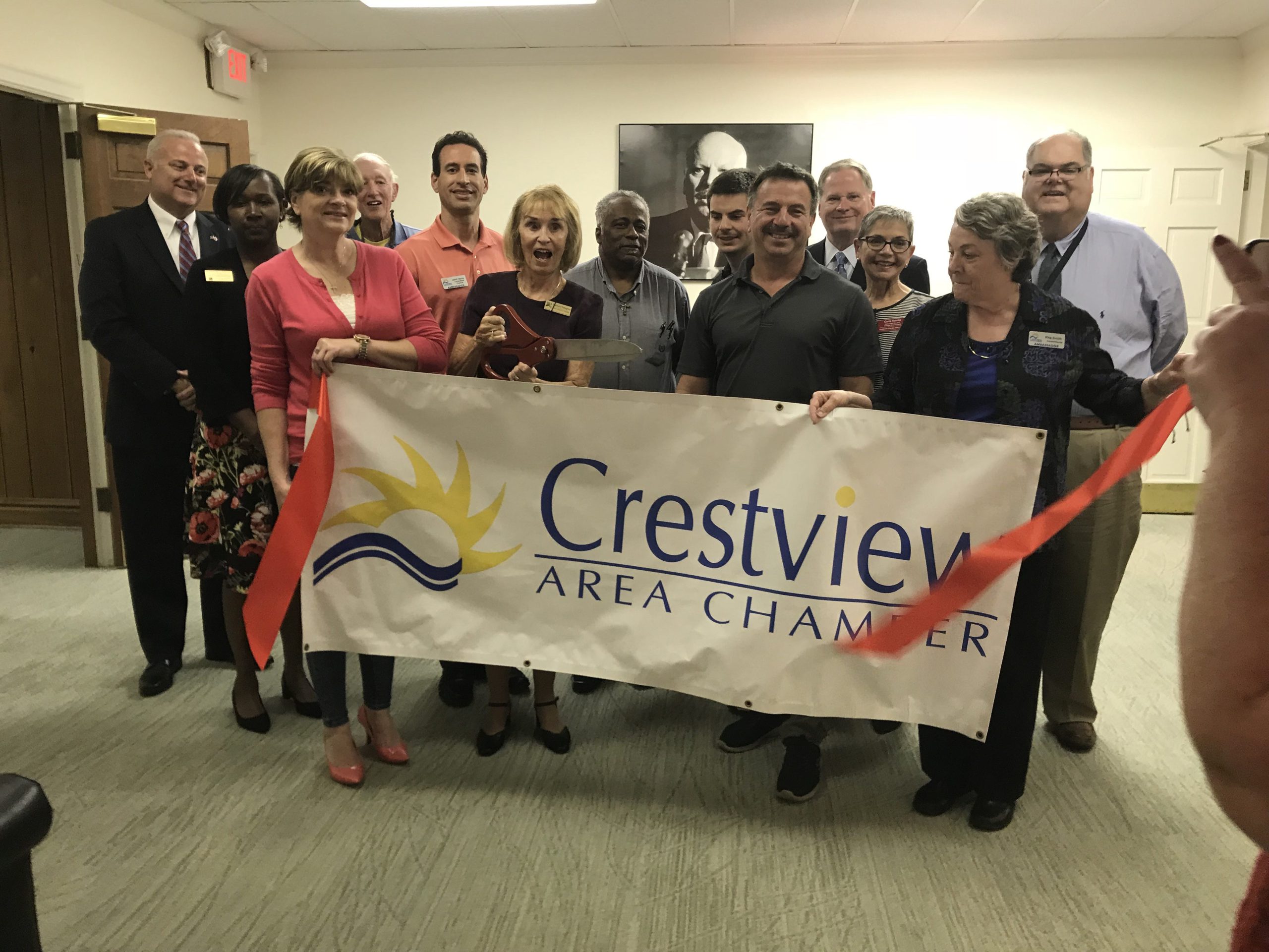Members of the Crestview Area Chamber of Commerce and others gather for a ribbon-cutting in the new office of State Representative Mel Ponder (left). [SPECIAL TO THE NEWS BULLETIN]