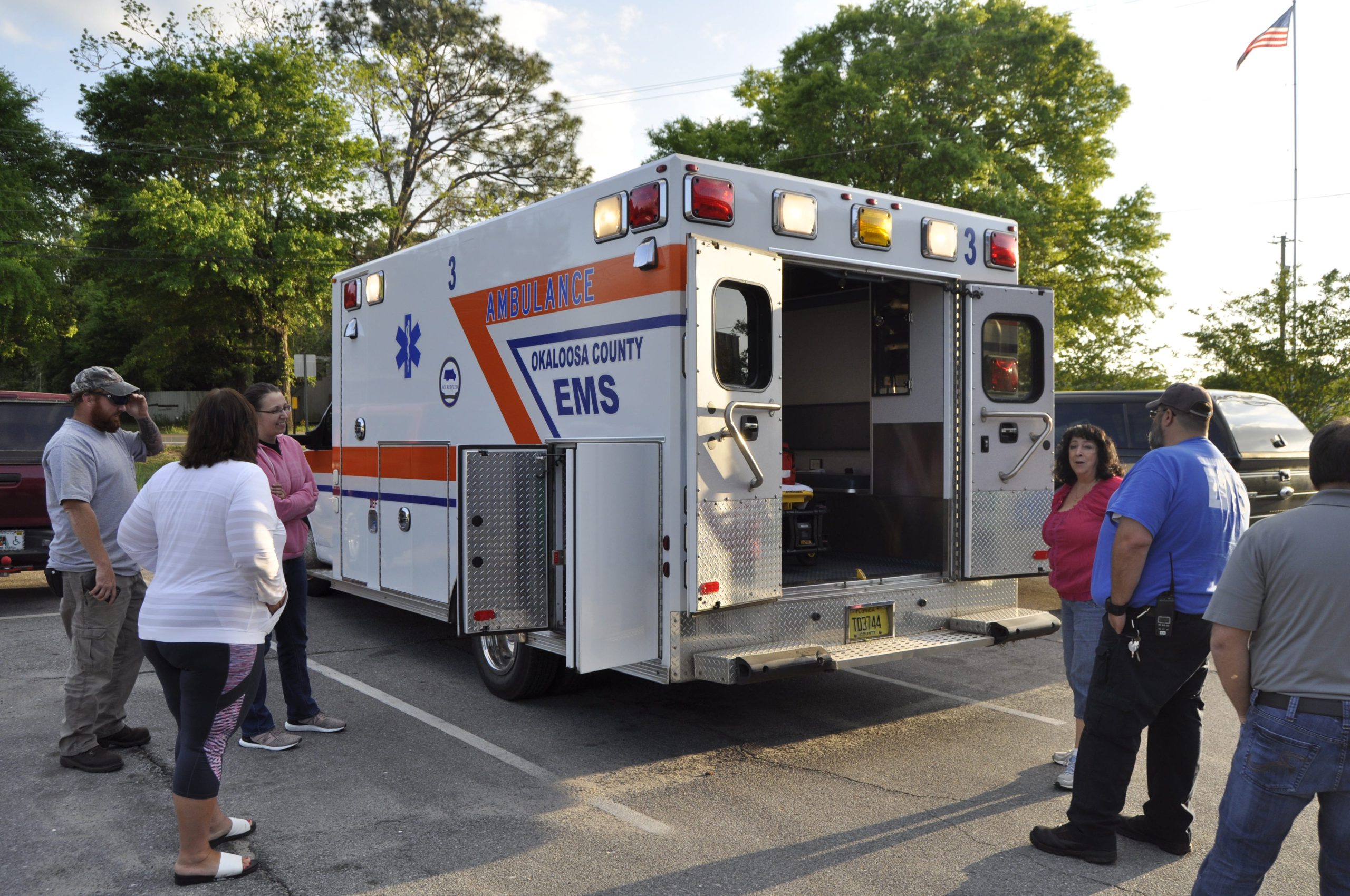 Attendees of the Crestview Citizens Police Academy program inspect an EMS vehicle. Okaloosa EMS and Crestview Fire Department officers were on hand to talk about their vehicles and equipment. [AARON JACOBS|NEWS BULLETIN]