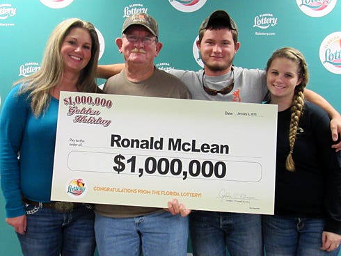 Ronald McLean, pictured with his family, claims his $1 million Scratch-Off prize at Florida Lottery headquarters.