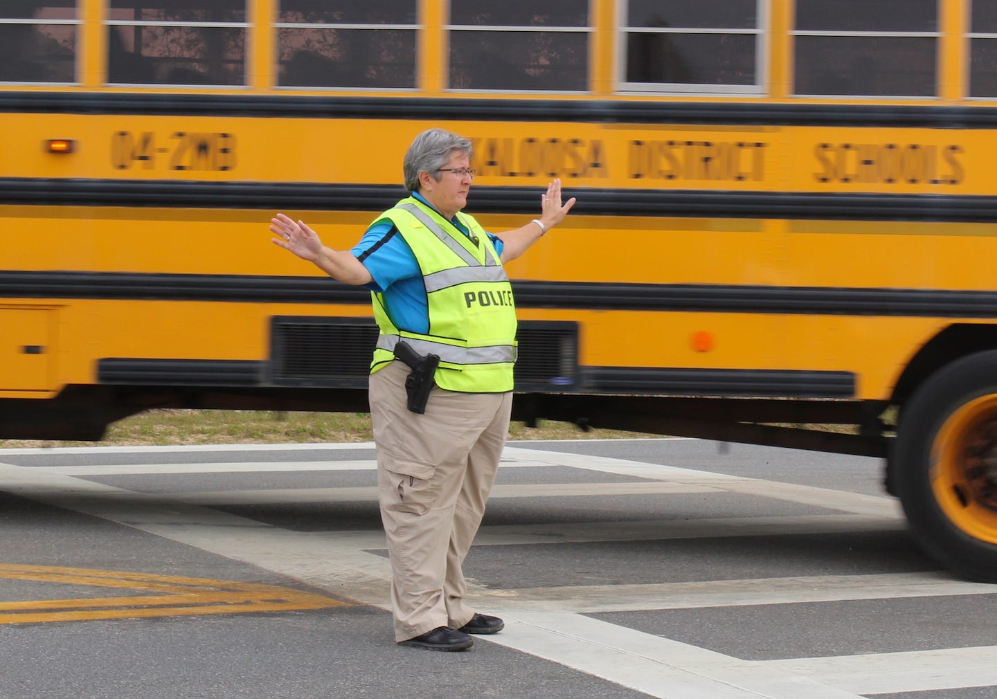 Wanda Hulion directs traffic at Antioch Elementary School as part of her community policing work. [SPECIAL TO THE NEWS BULLETIN]