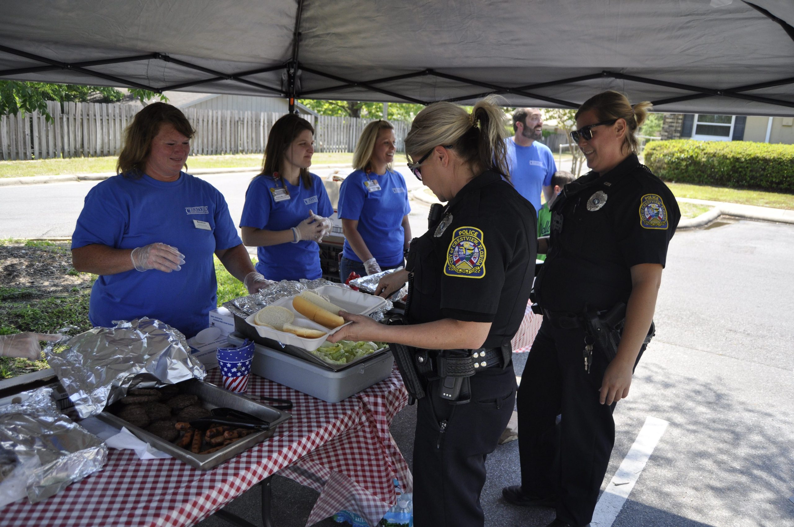Crestview Police officers stopped by Crestview Rehabilitation Center for lunch. The center held a cookout Wednesday for first responders. [AARON JACOBS|NEWS BULLETIN]