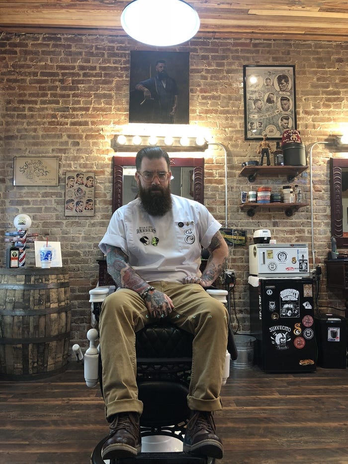 In this self-portrait he provided, Quentin Paulsen sits in his barber chair at the Hub City Barbers in Crestview. [SPECIAL TO THE NEWS BULLETIN]