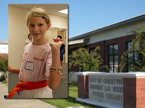 Amilia Babis, 9, of Crestview, shows off a bracelet she purchased with funny money July 28 during the Crestview Public Library's Reader Awards.