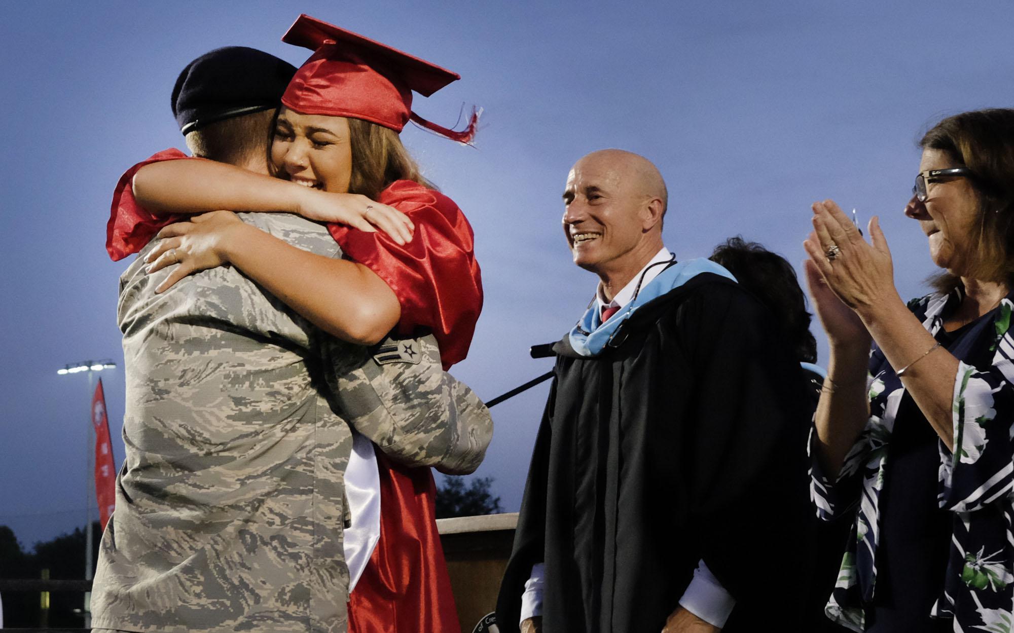 Mackenzie Griffin is surprised at the 2019 Crestview High School graduation by her brother Corey, who is an airman stationed in Nebraska. [MICHAEL SNYDER/DAILY NEWS].