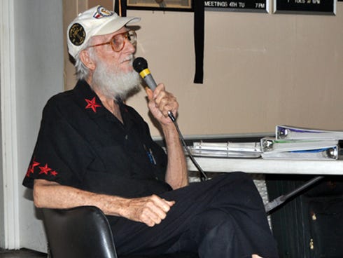 Mickey Givens, a Covenant Hospice patient, takes the microphone on Saturday night at American Legion Post 75. Givens made a final wish to sing karaoke for fellow Legion members.