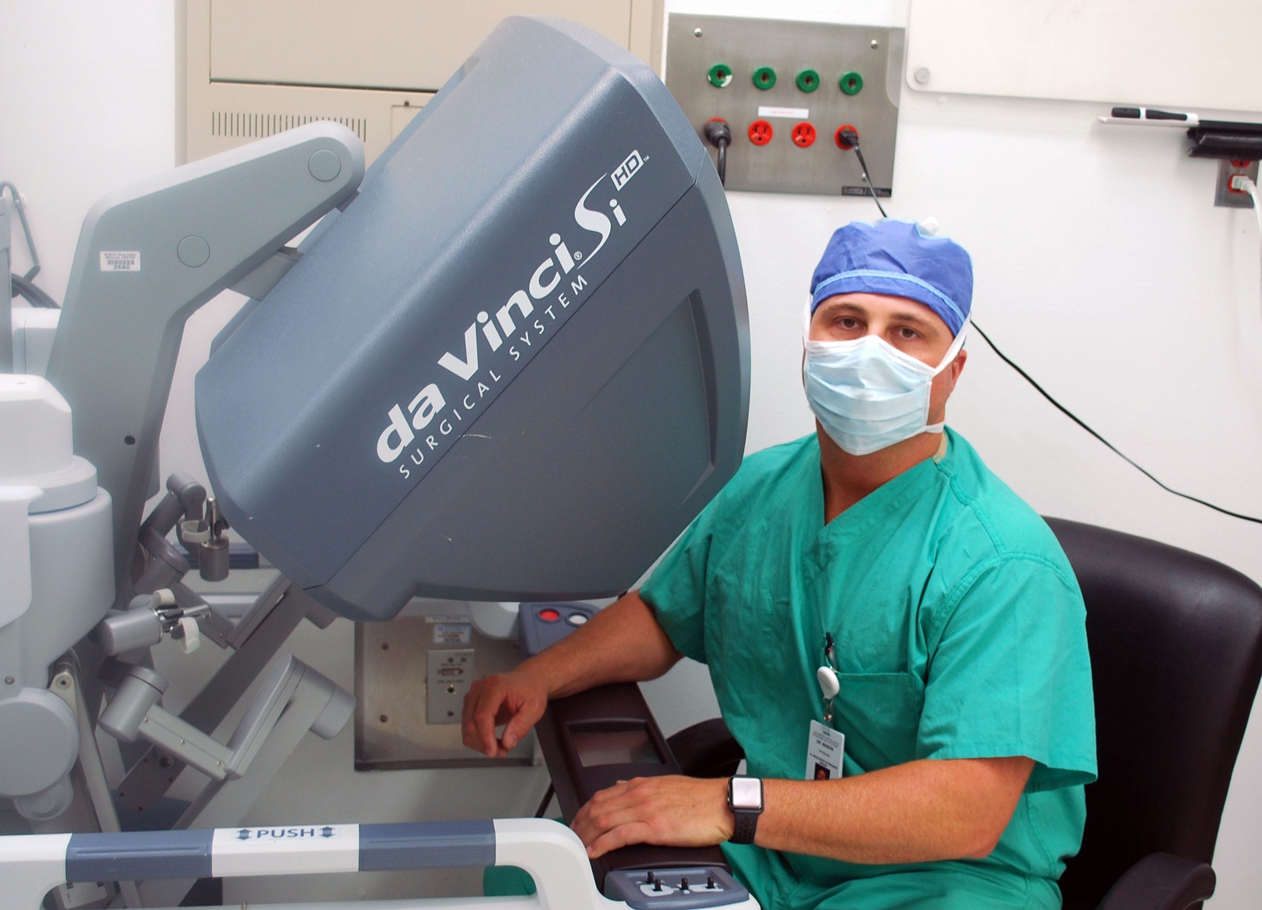 Dr. Mason performs surgery using the da Vinvi Surgical System. This system uses robotic technology that allows the surgeon to make precise incisions without touching the patient. [KELLY BERGMAN/CONTRIBUTED PHOTO]