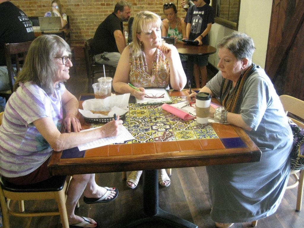 Crestview Centennial Committee members Viola Owens and Rae Schwartz meet with View From the Stage producer/director Berit Faust, center, to plan the “Spirits of Crestview” Oct. 14 ghost walk on Main Street.