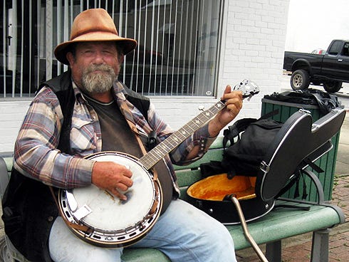 Rick Edenfield, “the Banjo Bear,” can be found just about every day plucking on Main Street in Crestview.