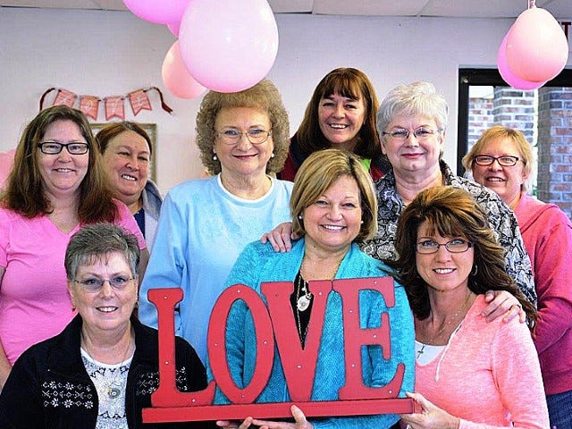 Scrapbookers Peggy Isler, Toni Dugas, Sandy Teets, Rhonda Smith, Sue Sweeney, Jayne Marshall, Shirley Snyder and Linda Norris have new ideas for scrapbook creativity following a weekend workshop with renowned professional scrapbooker Beatriz Farqunar-Guzman, bottom row center.