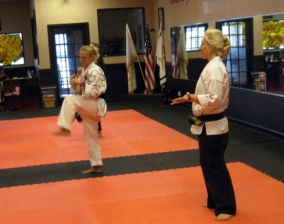 Gordon Martial Arts instructors lead a warm up session before the women's self-defense class Sept. 15 in Crestview. A simultaneous class took place at Emerald Coast Martial Arts in Fort Walton Beach. [RENEE BELL | NEWS BULLETIN]