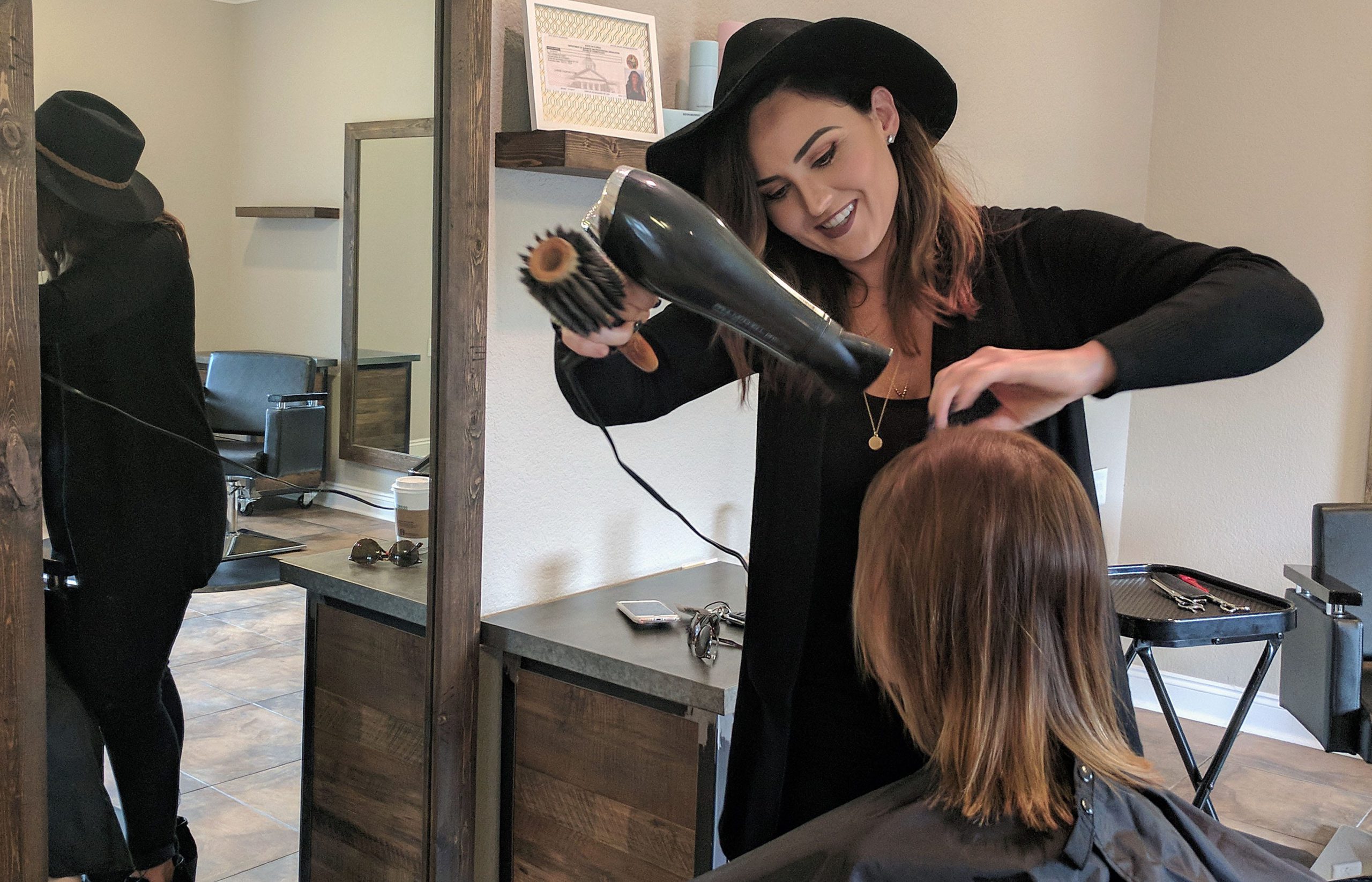 Courtney Durke gives her client a complimentary bangs trim. Bloom Beauty Bar opened in August. Durke said she wanted to bring something to Crestview with a more modern feel rather than a traditional hair salon. [KAYLIN PARKER/NEWS BULLETIN]