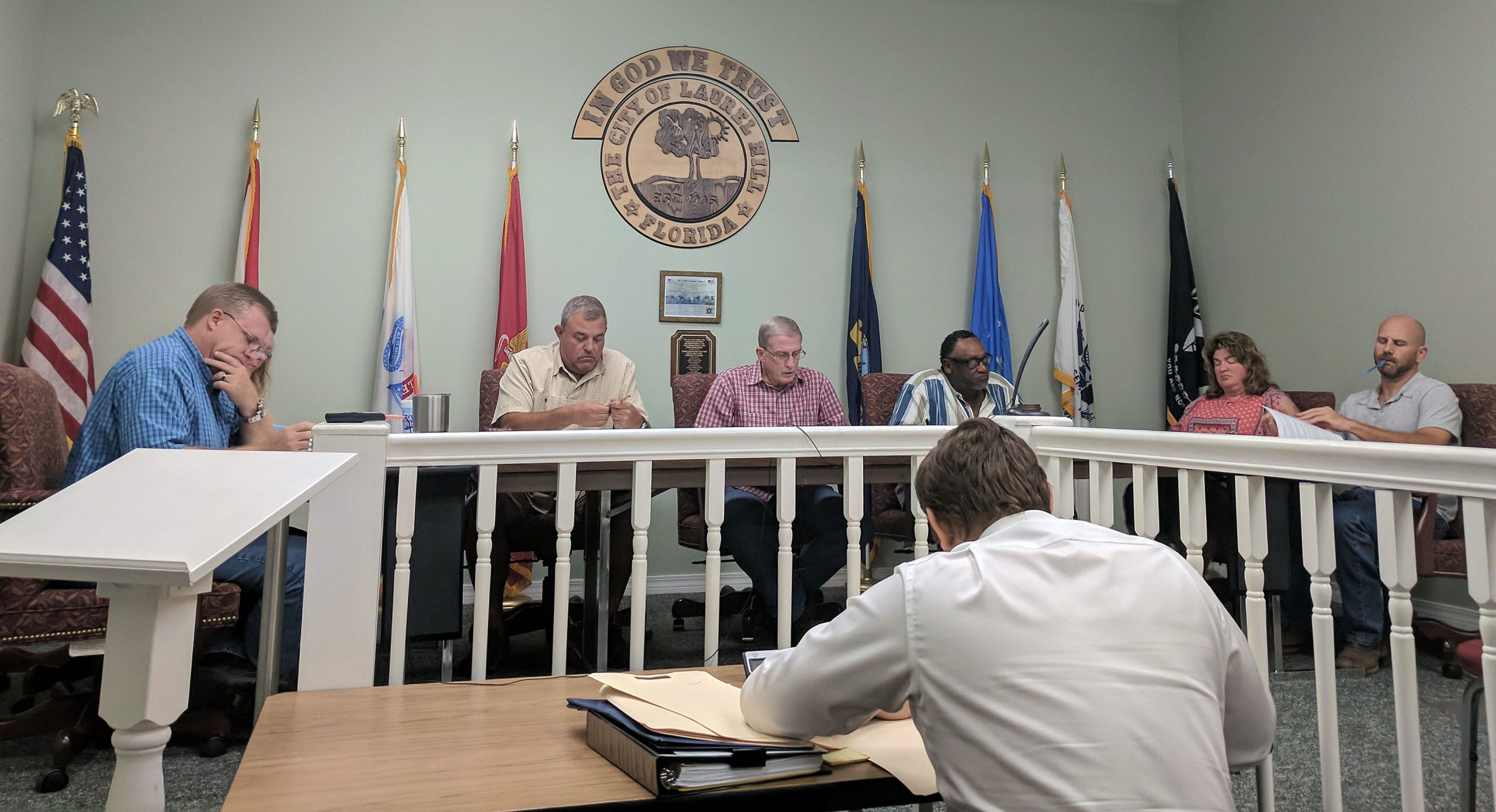 The Laurel Hill city council members follow along as the city clerk reads an ordinance at the Oct. 4 regular meeting. Laurel Hill's city council meetings are the first Thursday of every month at 6 p.m.

[KAYLIN PARKER/NEWS BULLETIN]