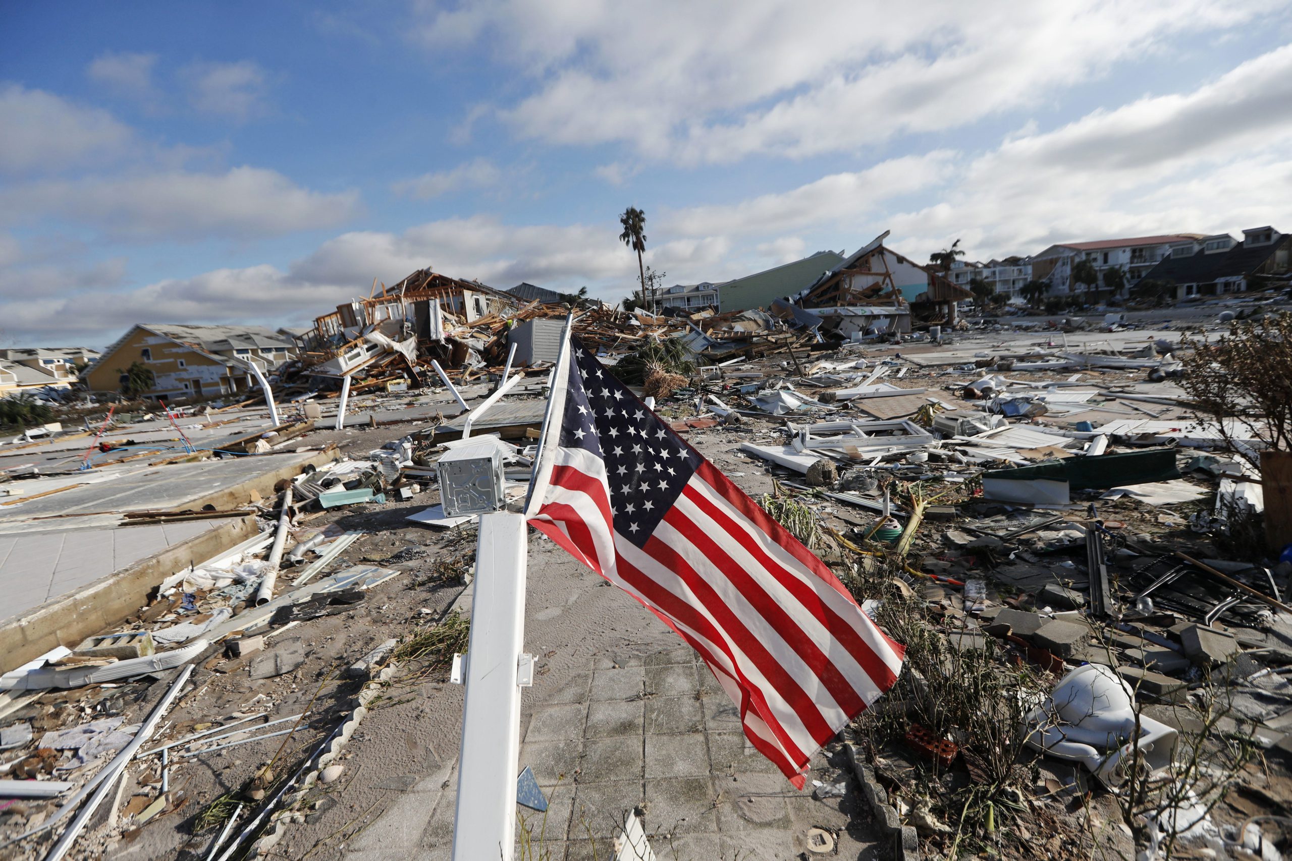 An American flag flies amidst destruction in the aftermath of Hurricane Michael in Mexico Beach, Fla., Thursday, Oct. 11, 2018. (AP Photo/Gerald Herbert)