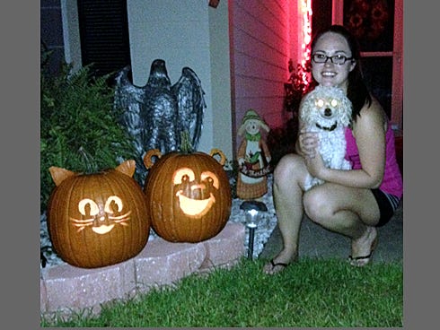 Northwest Florida State College student Nicole White, of Crestview — pictured with her poodle, CoCo Chanel — has won the News Bulletin’s 2013 Pumpkin Carving Contest.