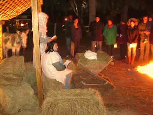 Student actors portray Mary and Joseph at the manger in Bethlehem during last year’s Living Nativity in Laurel Hill. Patches Wooten portrays their donkey.