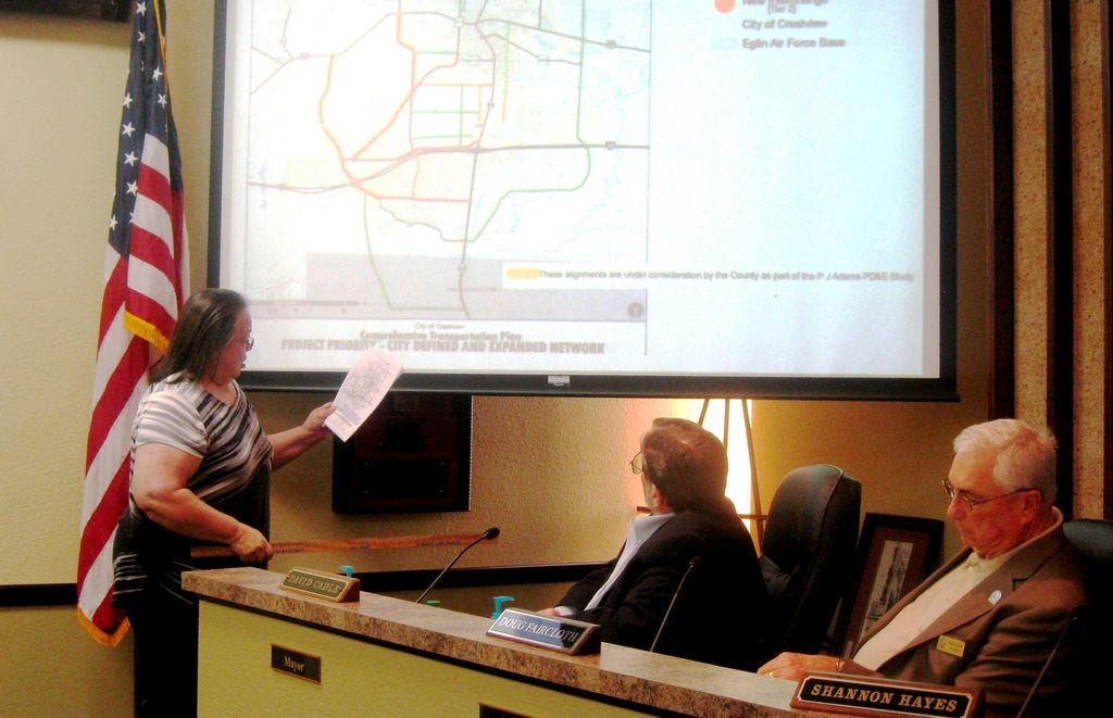 Crestview Growth Management Director Teresa Gaillard presents data on projected city growth needs to the City Council, including Mayor David Cadle and Councilman Doug Faircloth.