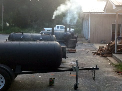 Four large cookers smoked racks of ribs Aug. 30-31 in front of the Holt Volunteer Fire District. The fire department collected $2,656 from the fundraiser, whose proceeds will help refurbish a brush truck.
