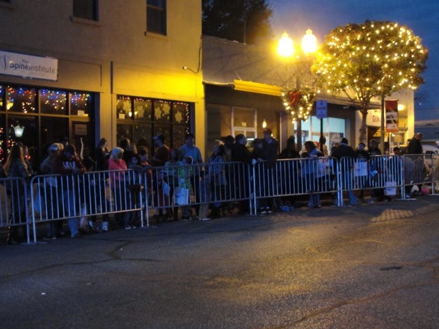 Residents line up for the Main Street Crestview Association Christmas Parade on Saturday night. [FILE PHOTO/NEWS BULLETIN]
