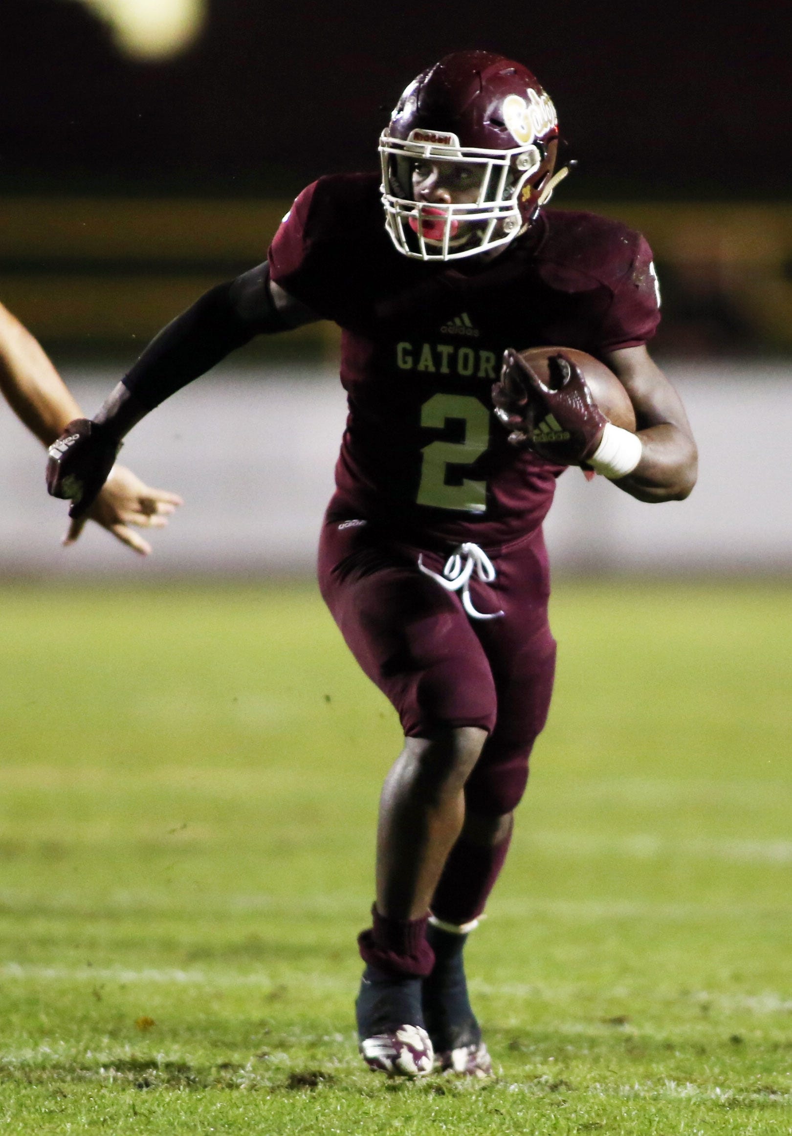 Junior McLaughlin carries the ball for a long gain as Baker hosts Freeport in their football playoff game.[ MICHAEL SNYDER/DAILY NEWS]