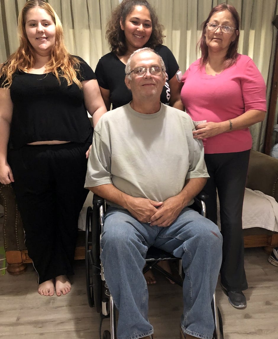 Kenneth Troutman, who survived an Oct. 31 wreck in Mossy Head, is pictured with his family, Victoria, Deserea, and wife Ivy (back row, from left). [SPECIAL TO THE NEWS BULLETIN]