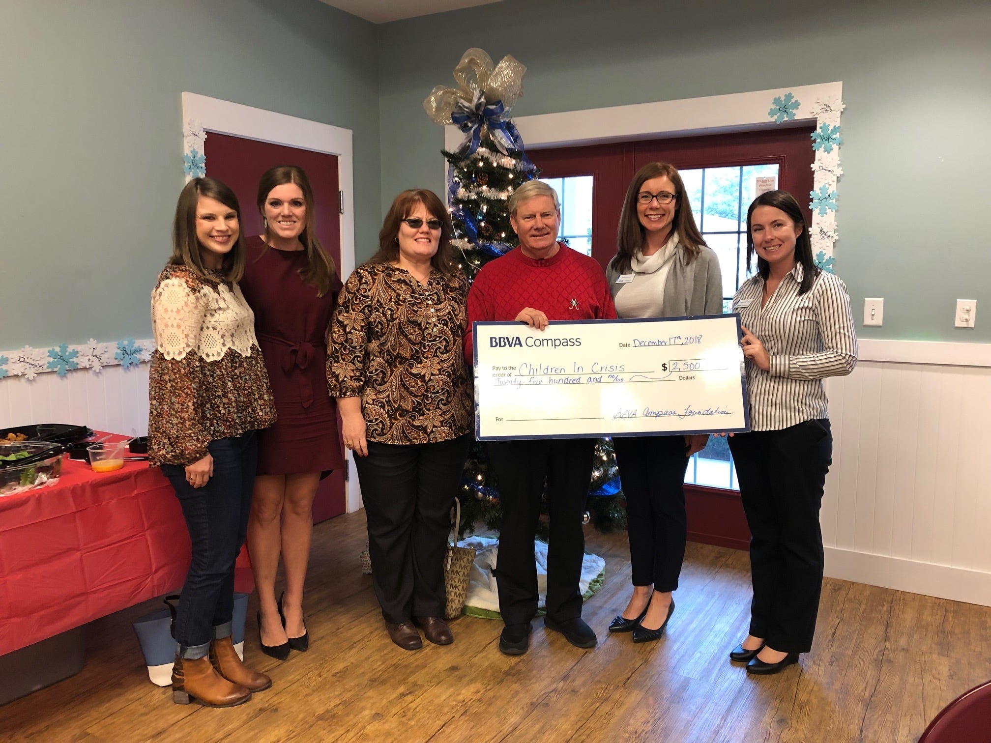 From left are Allie Noah, Children In Crisis Development Director, Lane Redding, BBVA Compass, Christi Osborne, BBVA, Ken Hair, CIC President and CEO, Katie Sharon, BBVA and Robin Donlon, BBVA, presents a donation of $2,500 from the BBVA Compass Healthy Habits for Healthy Kids program. [CONTRIBUTED PHOTO]