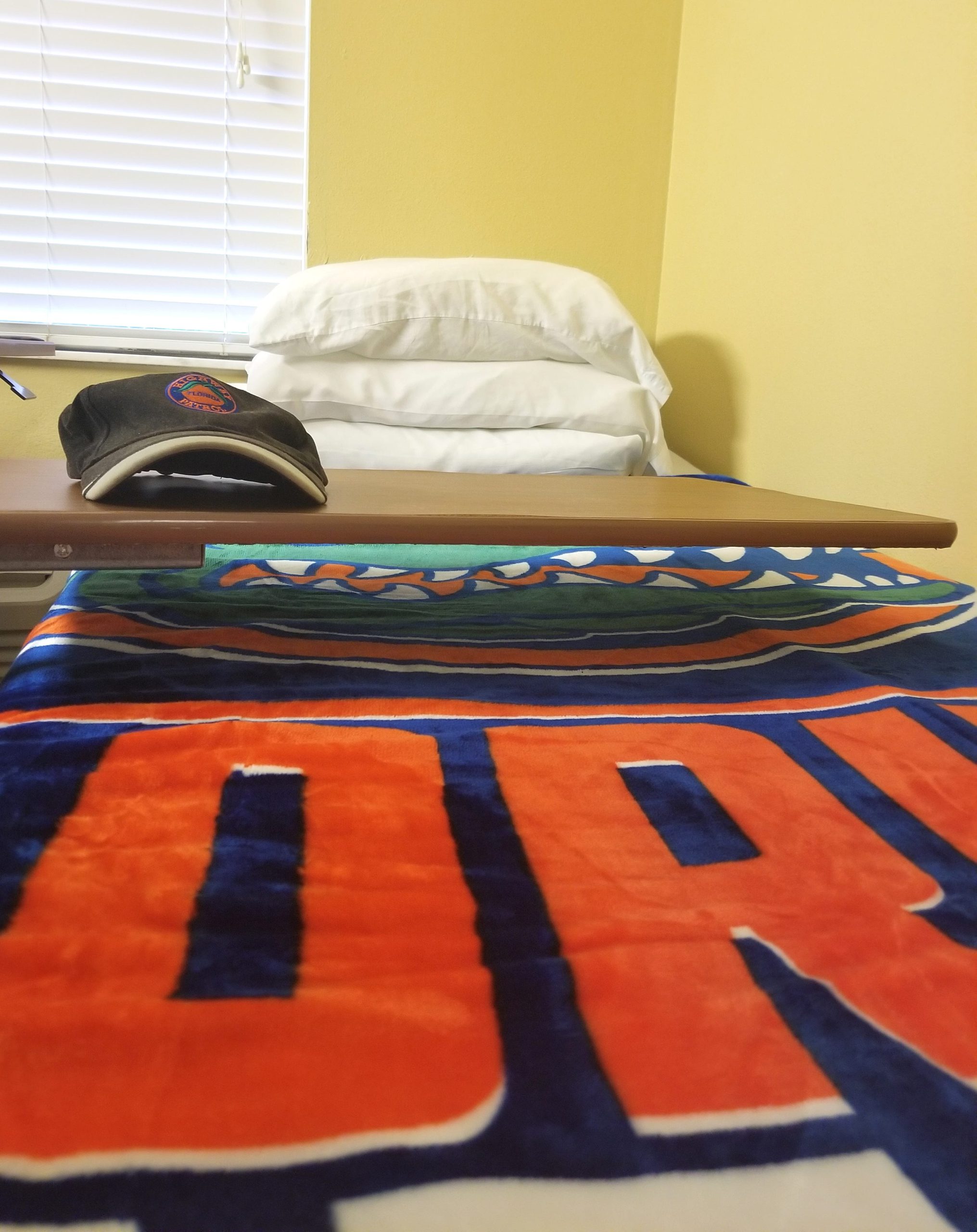 Some of the staff at Crestview Rehabilitation Center pitched in to buy Jerry Gates a Florida Gators blanket for Christmas. He was staying in the facility with his wife Betty after the nursing home she was in, and their home, was destroyed during Hurricane Michael. [ALICIA ADAMS/DAILY NEWS]