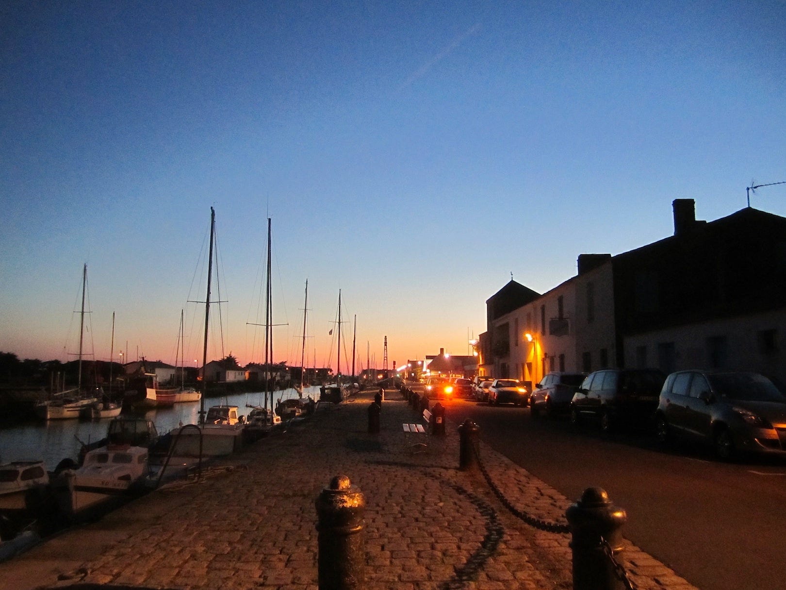 The summer sun sets over the harbor in Noirmoutier-en-l’Île, Crestview’s Sister City and the island’s largest community. A group from Northwest Florida will visit Noirmoutier in September. [PHOTO BY BRIAN HUGHES | SPECIAL TO THE NEWS BULLETIN]