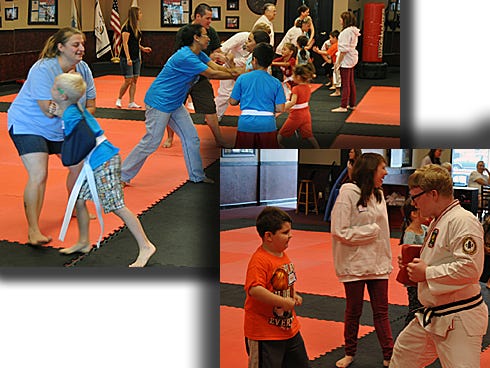 Top: Parents, grandparents and others could practice defensive moves with their children during “Stop the Bully” on Saturday at Gordon Martial Arts. Bottom: John Way, 5, practices punches with certified assistant instructor Richard Rousaville.
