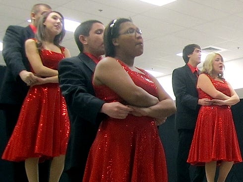 The Crestview High School chorus’ Chanticleer show choir performs for business and civic leaders at the chamber of commerce breakfast Dec. 6.