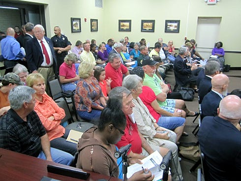 Civic leaders, residents and out-of-town Confederate heritage group members pack the Crestview City Council chamber Monday evening in anticipation of discussion about the Uncle Bill Lundy Memorial.
