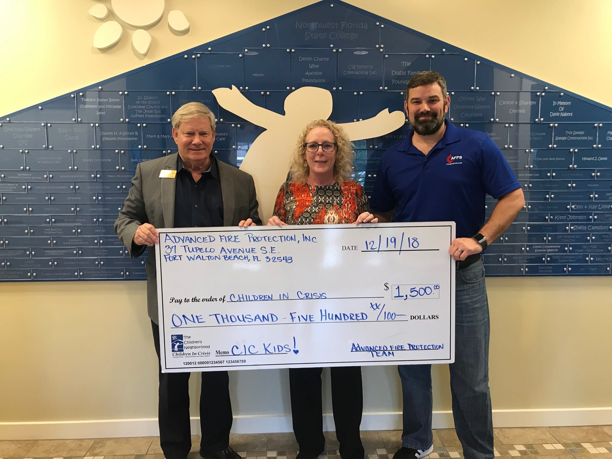 From left are Children In Crisis President and CEO Ken Hair accepting a donation of $1,500 from Jackie Kirly and Michael Sudheimer representing Advanced Fire Protection Services. The funds will be used to give local at-risk foster children a safe, loving home at the CIC Neighborhood.

[CONTRIBUTED PHOTO]