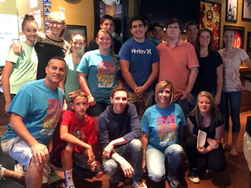 Joy Fellowship Pastor Joe Butryn gathers with the church's Senior High Youth Group members who recently collected 5,300 pounds of food for the poor. Bottom row, after Butryn: Bailey Palmer, Christian Watkins, April Butryn and Brooklyn Layfield. Top row: Marissa Butryn, Katelyn Chessher, Jewel Brooks, Crislynn Giles, Isaac Howard, Jordan Englebright, Chris Goodwin, Austin Walters, Brandon Prine, Hunter Phillips, Megan Ayala and Haleigh Butryn.