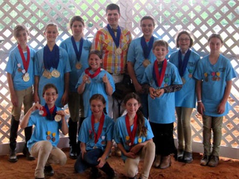 Annie Cooke, Caelyn Grodoski, Layla Overly, Mackenzie Barrow and Kiara Martin will compete in the Florida 4-H State Horse Show's junior class division next week in Tampa. Klarissa Williamson, Kelvin Williamson and Alex Cooke will compete in the senior division. They competed in the spring horse show in Marianna, along with other Round Up 4-H Club and 4-H Country Club members. Pictured at the spring show, back row, from left: Annie Cooke (12), Grodoski (13), Alex Cooke (17), Kelvin Williamson (17), Klarissa Williamson (14), Rebecca Paczkowski (9) and Barrow (10). Middle row: Grace Scofield (10) and Keenan Williamson (9). Front row: Martin (10), Trinity Overly (9) and Layla Overly (11).