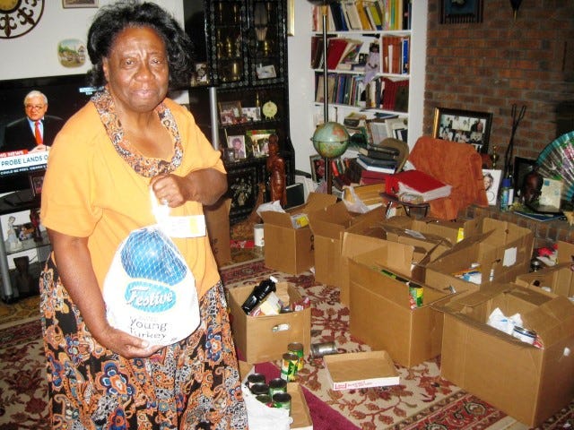 Mae Retha Coleman prepares to add a frozen turkey to the bounty of foods she regularly donates to Okaloosa County Head Start families and other needy residents.