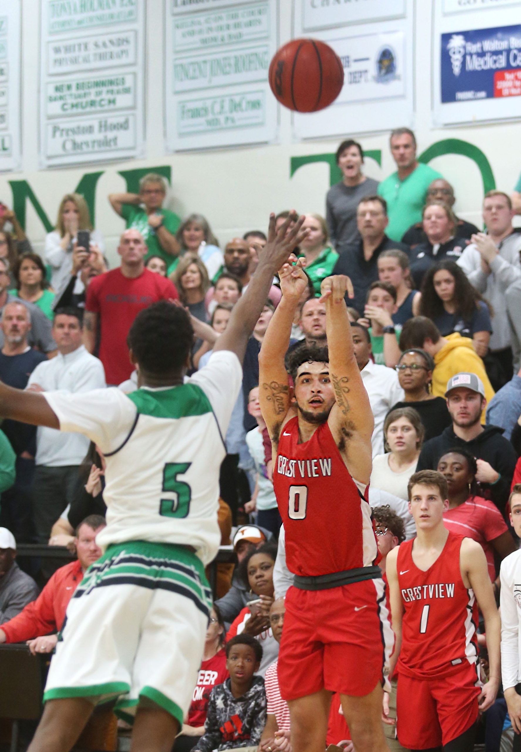 Marcus Purcell hits the game winning shot in the closing seconds as the Crestview Bulldogs upset the Choctaw Indians 61-58 in Regional semifinal basketball action at Choctaw. [MICHAEL SNYDER/DAILY NEWS]