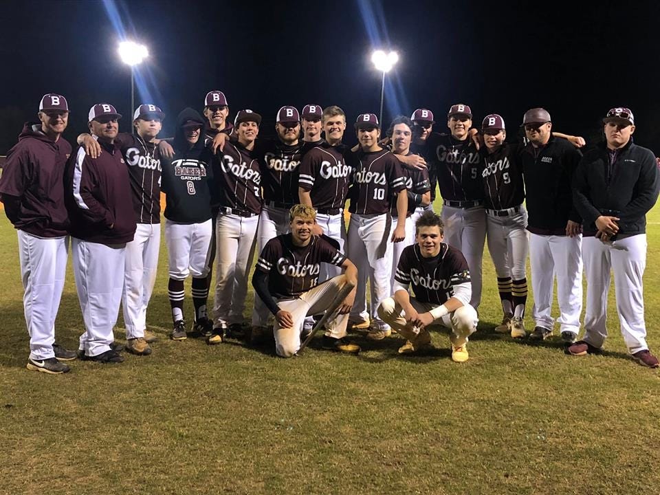 The Baker Gator varsity baseball team poses after beating Crestview 6-5 on Tuesday. [CONTRIBUTED PHOTO]