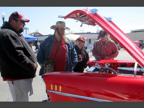 From left, Al and Vanessa Lucido and their sons Sal, 11, and Michael, 14, admire a 1957 Chevy Bel Air.