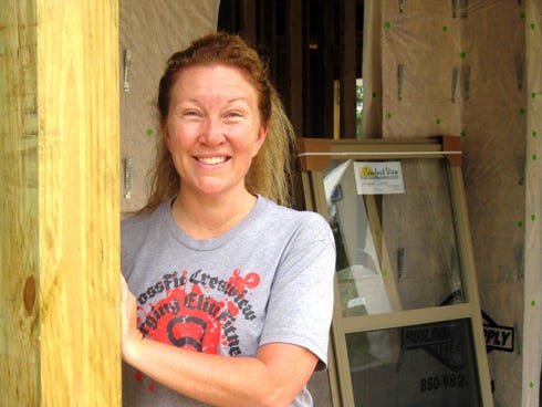 Crestview cancer survivor Jeri Toolan — on a job scene with her family’s construction company — says she maintains her active lifestyle thanks to a colonoscopy that detected her cancer early.