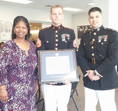 Leslie Laing, Penn State University’s assistant director of Adult Learner Programs and Services in Student Affairs, and U.S. Marine Second Lt. Jarett D. Tassone are pictured with U.S. Marine Staff Sgt. Bryan Smith, center. Smith, a Crestview native, is the 2016 Penn State Outstanding Adult Student Award recipient.
