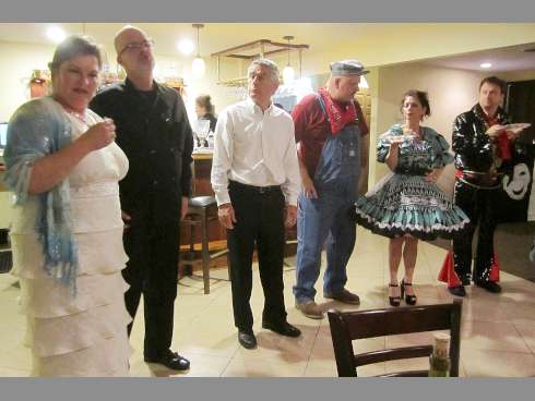 Cynthia Bergquist, Chris Manson, Joe Chase, Jim Downdun, Mary Ann Troiana and Ken Olsen perform a scene from "On Stage for Murder" at Christopher's Uncorked Bistro in Crestview.