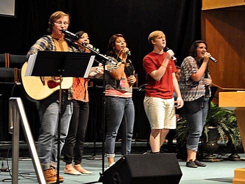 Emmanuel Baptist Church and First Baptist Church's youth members perform inspirational music for almost 400 people on Wednesday at Woodlawn Baptist Church. From the left are Evan Sammons, Melanie and Monica Marchena, Keller Lambert and Kelsey Colonna.