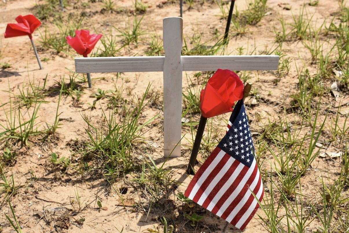The poppy field at American Legion Post 75 in Crestview consists of crosses, flags and homemade poppy flowers. [ASHLEIGH WILDE/GATEHOUSE MEDIA FLORIDA]