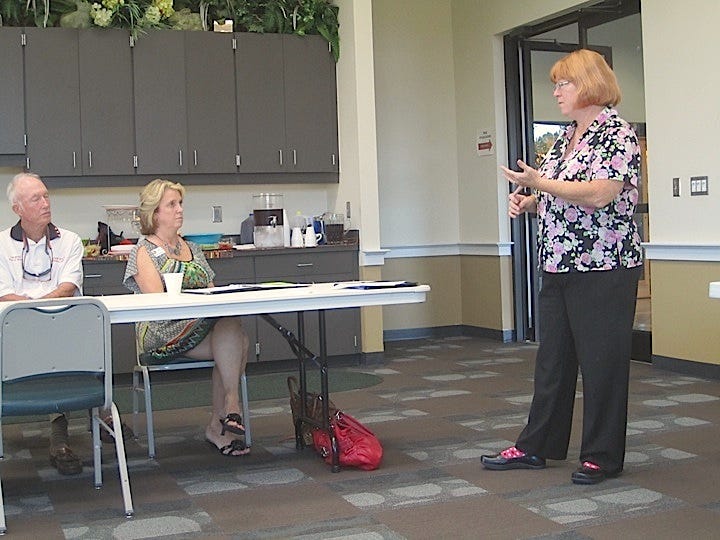 Vicky Stever, Okaloosa Library Cooperative coordinator, presents information about the Viva Florida 500 celebration to attendees at the Crestview Area Chamber of Commerce calendar workshop.