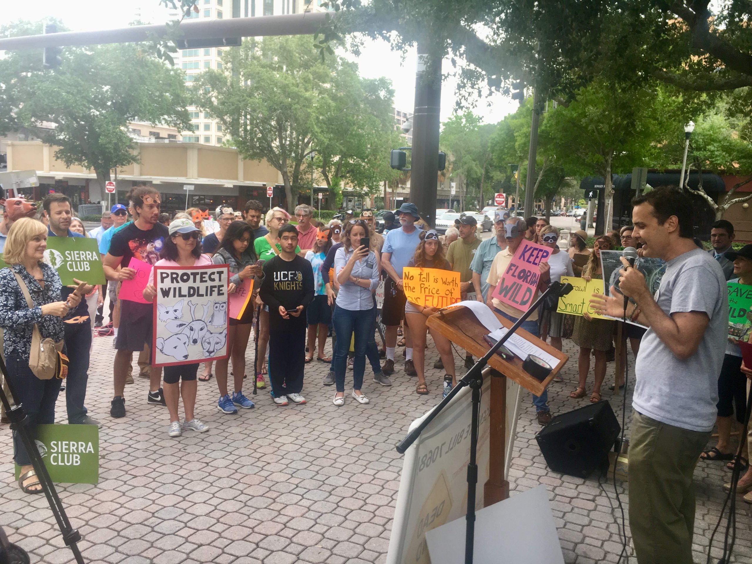Protesters gather in downtown St. Petersburg’s Williams Park to speak out against a bill that would authorize a toll road to Georgia. At right, Tim Martin, of the Sierra Club Florida, urged the public to call the office of Gov. Ron DeSantis and ask him to veto the measure. [TNS file]