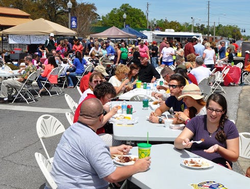 Attendees enjoy barbecue during the 2013 Triple B Cook-off.