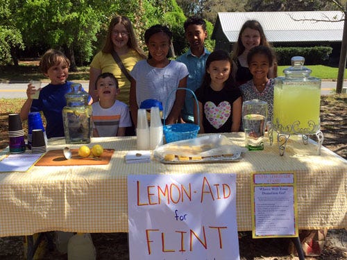 Okaloosa residents and Unitarian Universalist Fellowship of the Emerald Coast attendees raised money to help Flint, Michigan children. Back row, from left: Peregrine Conroy-Baarsch, Crestview resident LJ Guthrie and Suwanee Conroy-Baarsch. Front row, from left: Cypress Conroy-Monteith, Logan Marshall, Ella Farley, Kayla Marshall and Crestview resident Aaliyah Guthrie.